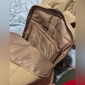 Beige Backpack with Multiple Compartments